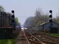 <b> ANY TIME CAN BE TRAIN TIME! </b> My wife and I were in the midst of a long and grueling day trip up to Picton, when we stopped in a parking area between the CN Kingston Sub, and the CP Belleville Sub for some lunch. After 20 minutes, we decided to continue our trek home to Jarvis, when I hopped out and took a look down the CN line...sure enough, in the distance, it was going to be train time!
<br>
This would turn out to be VIA 6408, warpped in the Coors Silver Bullet theme, leading it's entourage of stainless steel cars as it headed east towards it's next station stop at Belleville.