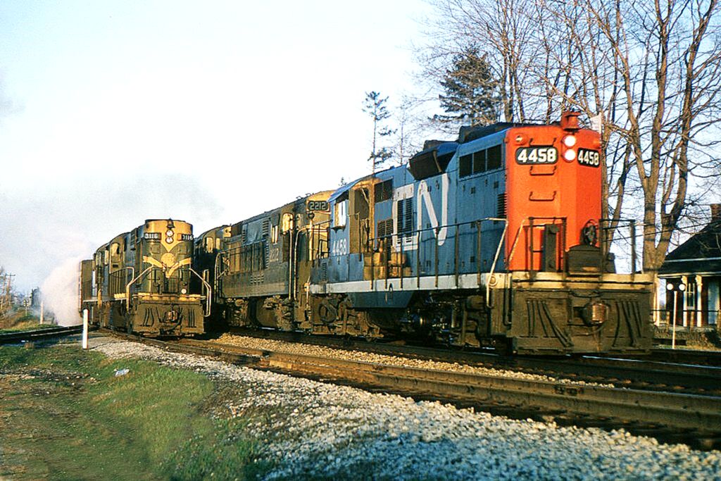 No 27 with 3116 leading, the all stops evening local from Belleville to Toronto has backed into the service track at Bowmanville to allow a westbound freight to pass. The freight has a GMD-CLC-MLW combination for power. The local was pool train number 9 until the pool agreement ended in October 1965. The end of this local service would soon leave Bowmanville with no passenger rail service. Thanks go to Ron Visockis for fixing an unwanted reflection in the photo.