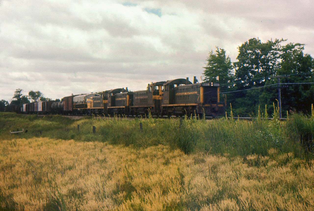 CN SW1200RS 1234 leads 3 mates and a new FP9 eastbound at Port Credit. The FP9 is part of CN's last order for 10 and the last F units built by GMD in London.