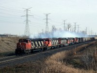 Help with location please, info lost. CN 381 with 9519 5070 5100 an unidentified MILW unit CN GP9 and a Sweep accelerate west bound some place in  Toronto.