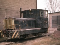 Here's a somewhat rare shot of the old Canada Crushed Stone Ltd all-purpose locomotive that sat up on the CCSL property at Dundas for a few years after the operation shut down in the early 1970s. The structures of the CCSL were prominent features along the hillside over Dundas for many years, and for a time the outfit interchanged with the CN and the TH&B which came up thru Dundas by way of Aberdeen yard. I do not know where this unit ever ended up, I would imagine it was trucked out as the quarry "mainline" had been torn up by the time I took this photo. Using information supplied by noted author and authority on Industrial and "Critter" locomotives, Steve M. Timko, this 24 Tonner Plymouth was built in 7/7/1927 model" HLC-3, a 127 HP gas-mechanical Climax R6u engine. It had been on the CCSL since 1930. (Hope I got that right, SMT !!) The quarry is still in business, now ships via truck and the main operation faces Hwy 5 near Brock Rd.