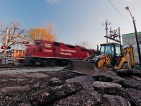 Work is done for the day and the guys have gone home, tomorrow will be another day as track panel replacement continues. A GP38-2 rumbles on through leading the evening Expressway to Montreal. 