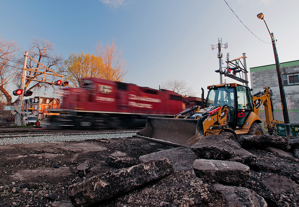Work is done for the day and the guys have gone home, tomorrow will be another day as track panel replacement continues. A GP38-2 rumbles on through leading the evening Expressway to Montreal.