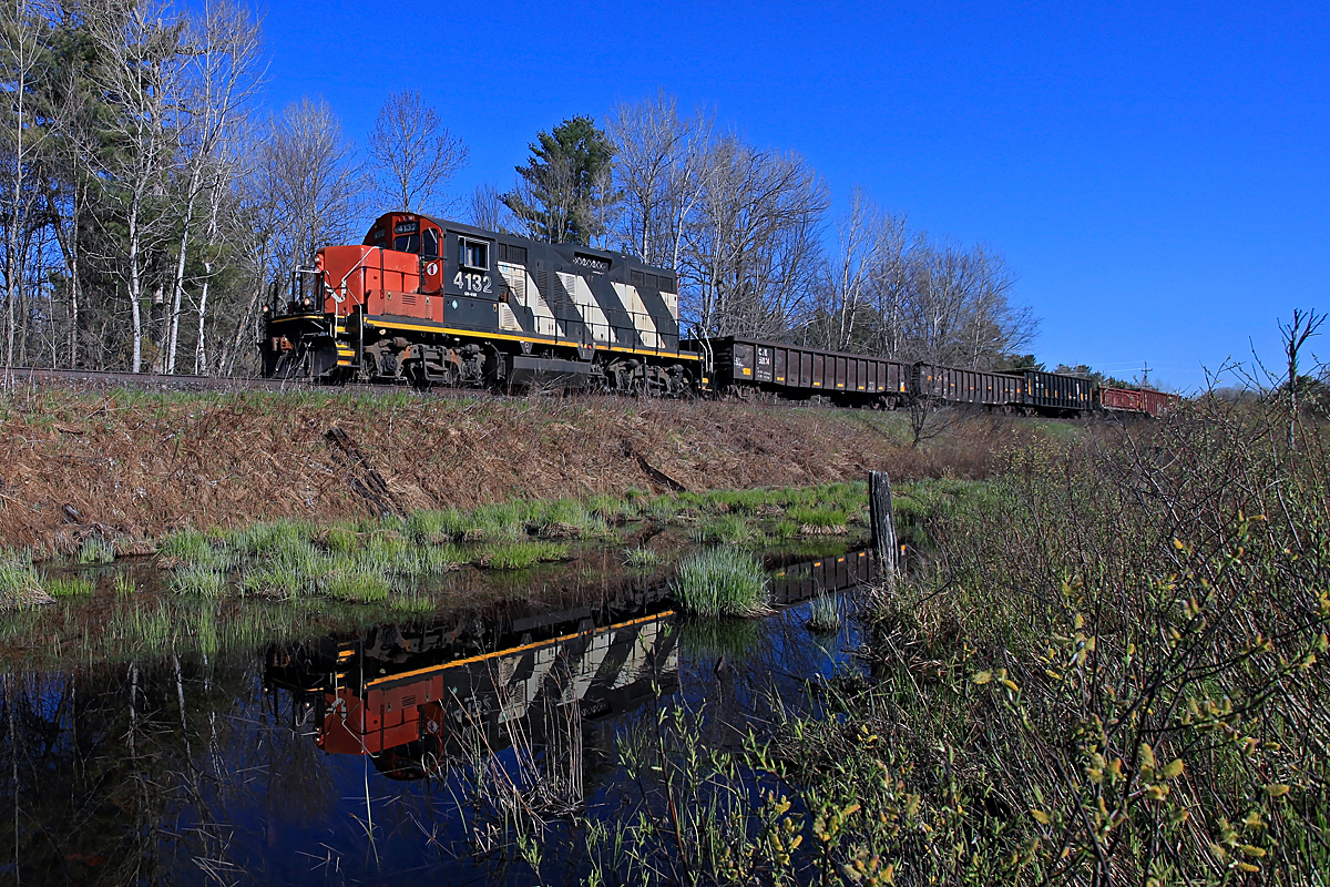 Ah, the difference a couple of weeks makes! The last picture I took at this location exactly two weeks ago was in the middle of a mini-blizzard (  http://www.railpictures.ca/?attachment_id=24438  ). This morning was sunny and warm, and by evening the year's first wave of blackflies was on the attack!