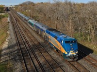 With a bashed-up nose VIA 905 leads a mixed bag VIA 75 under the Lemonville Road bridge shortly after departing Aldershot Station.