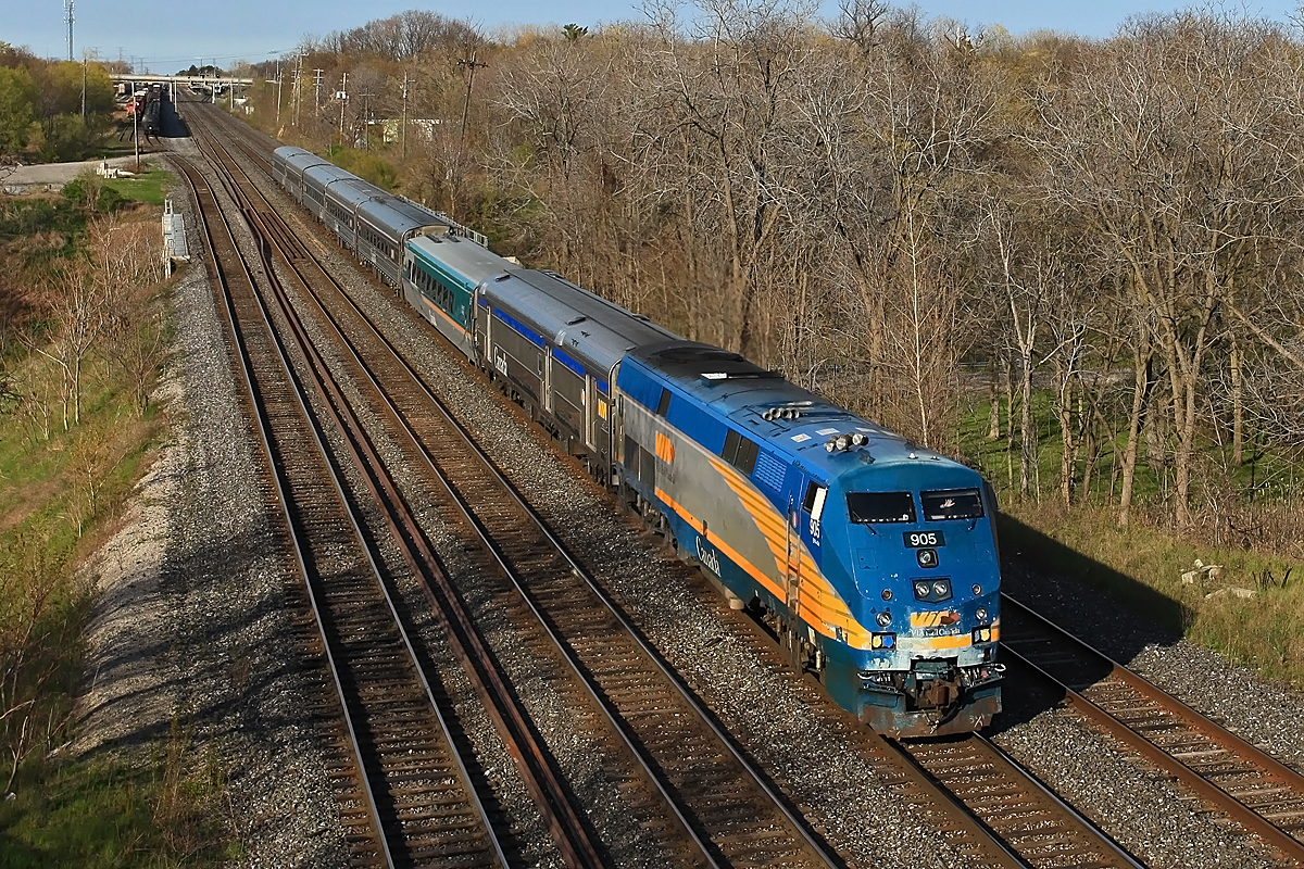 With a bashed-up nose VIA 905 leads a mixed bag VIA 75 under the Lemonville Road bridge shortly after departing Aldershot Station.