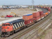 CN 2405 works hard to bring 121's tail end through Whitby, bound for BIT.

The previous day's 121 had engine problems and was forced to drop it's tail near Belleville.