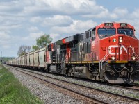 A trio of GEVOs work together and do what they do best, as they haul a loaded potash train up the grade towards Port Hope.

CN 2827, CN 3054, pusher DPU CN 2848