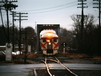 How it all began. This photo of the Sunday evening Havelock to Toronto Dayliner taken by brother best exemplifies my introduction to railroading. I was born and raised in Peterborough. Our family would use the Saturday train for trips to Toronto. The train would seem to take forever to arrive due to the city's 10 mile per hour speed limit. No horn blowing either. All you could do was wait and watch the Mars light flash as it slowly made its way to the station. I have lots of good memories of these trips, seeing the countryside, passing through Agincourt yard, crossing the Leaside bridge, the then filthy Don River, Don Yard and into Union Station. I vividly remember one trip back from Toronto during a blizzard, probably in 70 or 71. Drifts had blown across the line, and in the open stretches the engineer accelerated as much as possible before hitting the drift. Once we hit the drift, you could feel and hear the car pushing through the drift. The speed would drop and drop until finally we would break through. Then we would accelerate as quickly as possible before the next drift. When we arrived in Peterborough the crew were looking under the first car. The drifts had dislodged a 5 foot square pan on the underbody which was now only secured by a 4 inch wide strip of aluminum and dragging on top of the rails which could have caused us to derail. The crew tried going back and forth a few times to dislodge it to no avail. In the mid 70s we started driving to Pickering and taking the GO train in to Toronto. I didn't ride again until 1981 when I went to college in Scarborough, and used it for a few trips home until the train was cut by VIA. 
