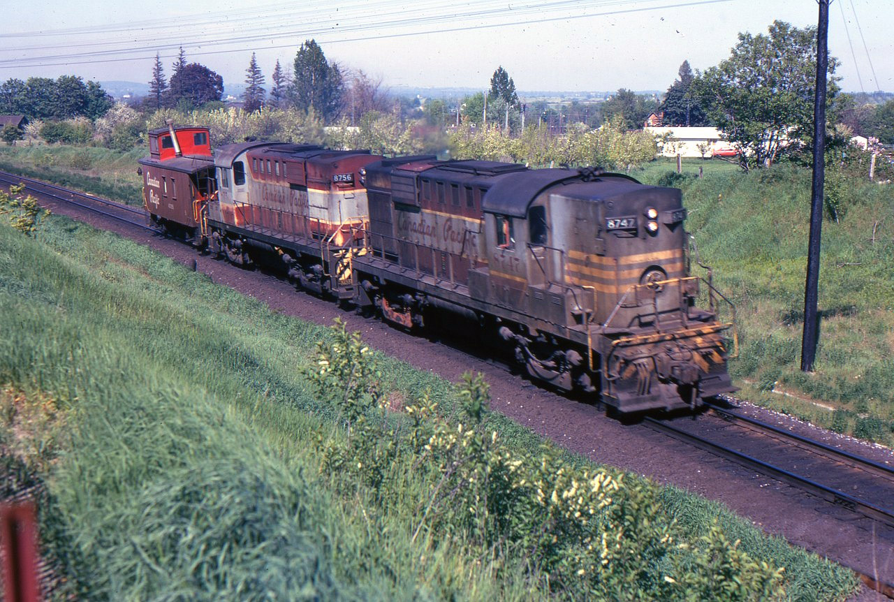 The westbound Cobourg turn at Bowmanville this May 28, 1972 is well supplied with dirt and short on revenue cars. The Cobourg turn still runs, sometimes to Trenton, but not every day.