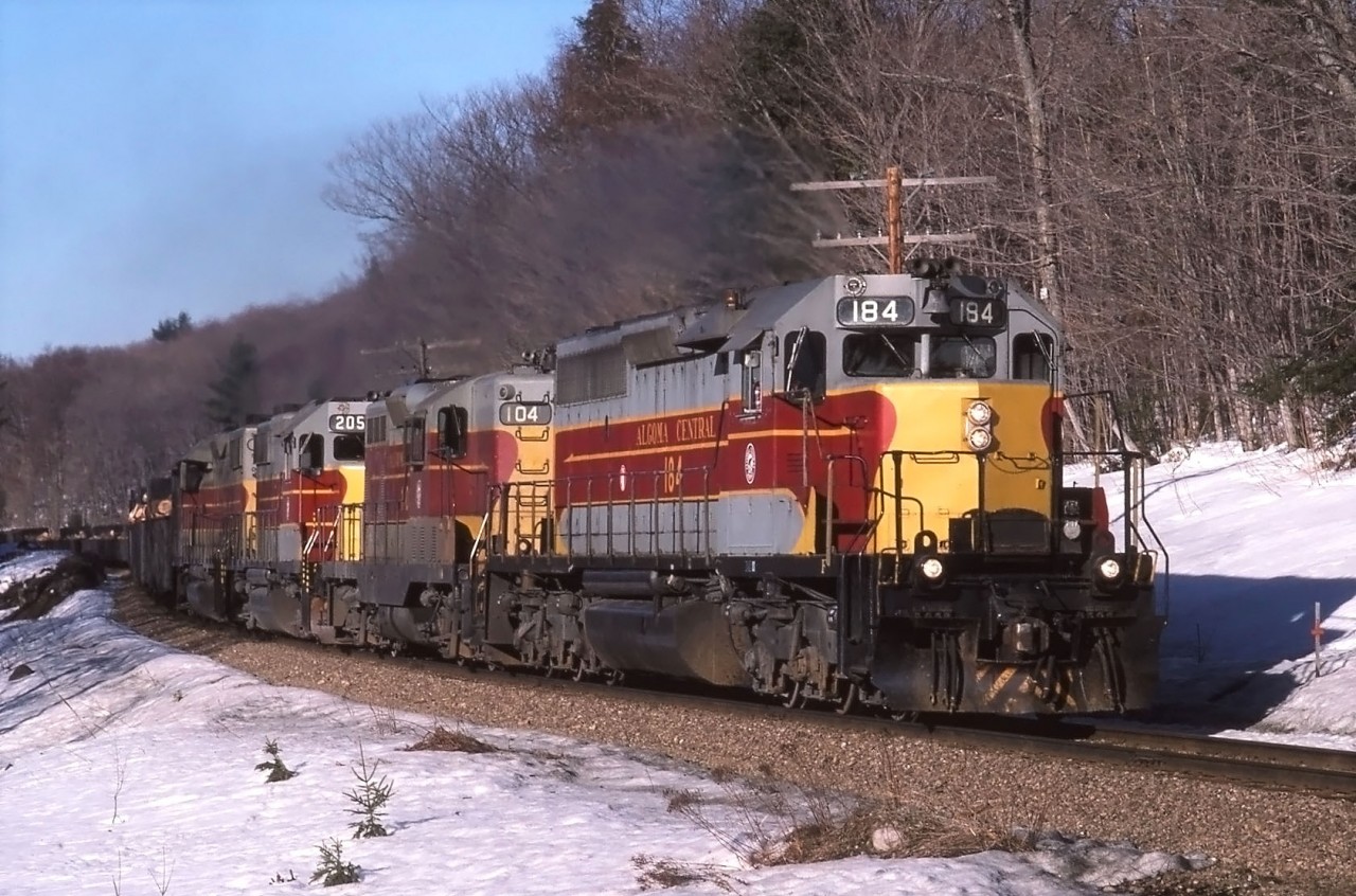 ACR train 12 makes its way south in March 1987 at Bellevue. 184, 104, 205 and 203 are leading 63 cars a couple miles south of Bellevue Trestle.