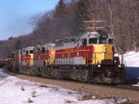 ACR train 12 makes its way south in March 1987 at Bellevue. 184, 104, 205 and 203 are leading 63 cars a couple miles south of Bellevue Trestle.