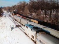 Something to wish for if you attend the CNET gathering (or RP members meet, if you prefer) on June 18th is to see all three tracks occupied at the same time by moving trains. It is not easy. Best chance, I would think, is in the morning, as featured here. CN freight heading up the Dundas on the north track; middle track has VIA #70 eastbound and south track has AMTK 201 #97 heading toward Niagara and the USA. Time would be around 0915. I think the AMTK was a few minutes late.