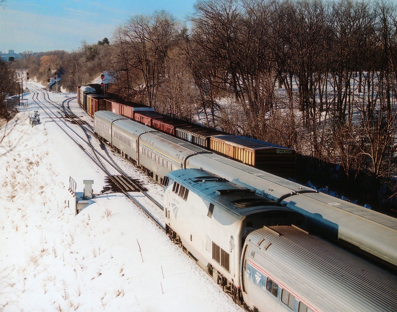 Something to wish for if you attend the CNET gathering (or RP members meet, if you prefer) on June 18th is to see all three tracks occupied at the same time by moving trains. It is not easy. Best chance, I would think, is in the morning, as featured here. CN freight heading up the Dundas on the north track; middle track has VIA #70 eastbound and south track has AMTK 201 #97 heading toward Niagara and the USA. Time would be around 0915. I think the AMTK was a few minutes late.
