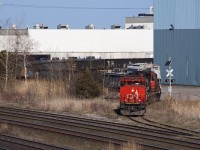 The Oshawa Yard Job pulls a decent sized string of cars out of Gerdau. The bridge will likely be closed within the next week as South Blair St. is paved, painted, and was being cleaned this day.