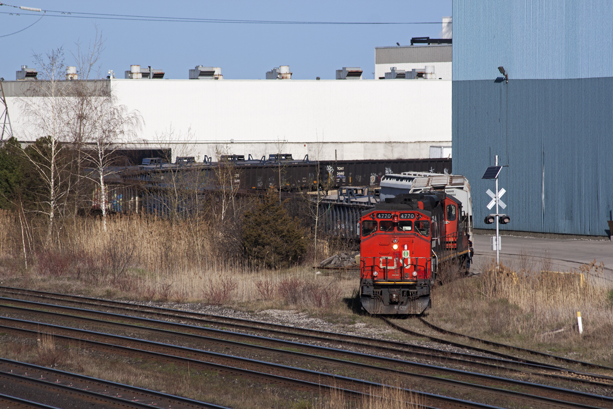 The Oshawa Yard Job pulls a decent sized string of cars out of Gerdau. The bridge will likely be closed within the next week as South Blair St. is paved, painted, and was being cleaned this day.