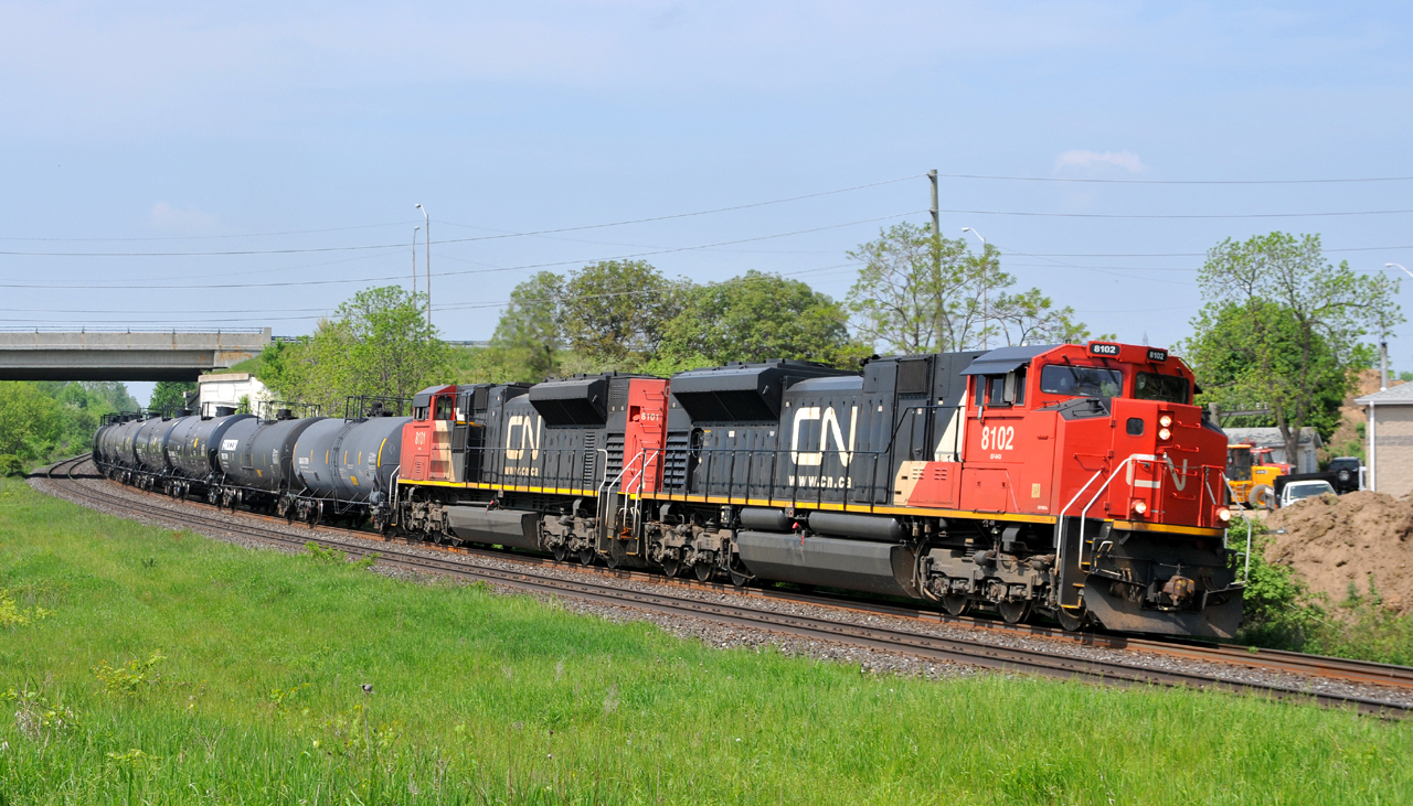 394 rolling east through Garden ave with CN 8102 - CN 8101 and 176 cars