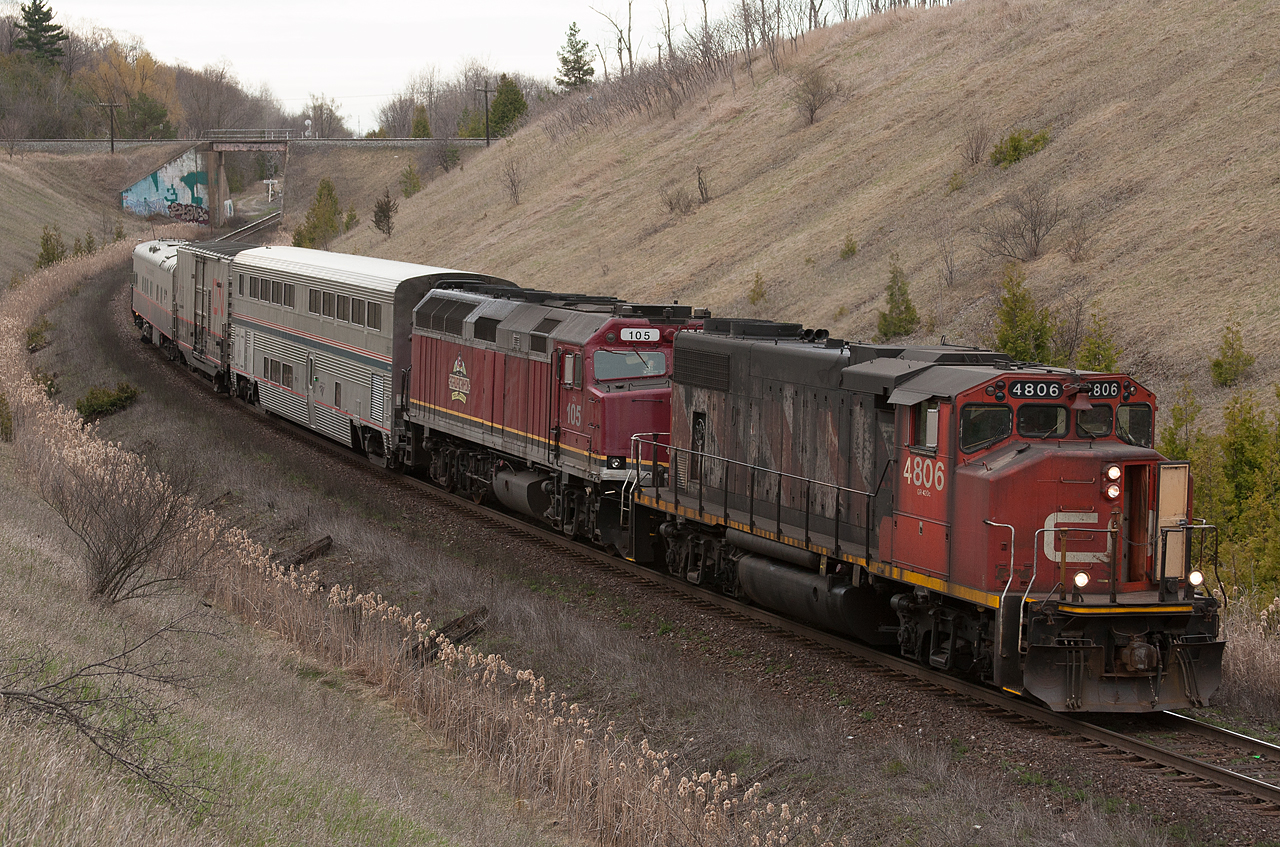 Halifax to New Orleans TEST Train O 99911 27 eases upgrade through Beare on the block of CN M 37321 28.  The TEST train is powered by CN 4806, CN 105 (typically used on the Agawa Canyon Tour Train out of the Soo) and 3 cars: Amtrak sleeper 39037, CN 414852, CN 1057.  The 105 had been the sole power on the train from Winnipeg to Moncton, where it failed and CN 2197 was added to the train.  At Halifax, CN 4806 was lifted and left in the lead position back to Toronto where the power would be swapped once more for the trip down south.
