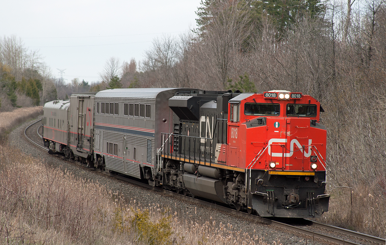 CN TEST Train O 99911 27 cruises down grade at Mile 30 on the Halton Sub after meeting 148 at Speyside.  The TEST Train had unfortunately set out CN 105 at Mac Yard and departed with the CN 8016 and 3 cars: AMTK 39037, CN 414852, CN 1057.  O 99911 27 is operating from Halifax to New Orleans, where it will turn back north and set out the Amtrak sleeper in Chicago.  To see the train 6 hours earlier east of Toronto click the link   http://www.railpictures.ca/?attachment_id=24504