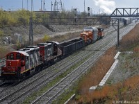 As a crew member lines the switches, CN 4112 and 7068 begin to shove 350's train into that yard at Oshawa Center. The D9 load on HEPX 200 made for a rather slow shove to the interchange at the auto compound to the south. 1633hrs.