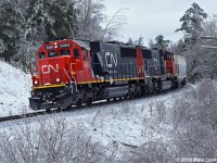 A late winter ice storm has allowed one last chance to shoot in a winter wonderland before spring weather arrives, and with slim pickings over the winter of 2015/2016 for snow in my locale, this was most appreciated. Also appreciated was the chance to shoot a 412 with CN 5454 and 5777 as power. And I have it on good word that the hogger on this train was thrilled to have the SD60 leading, appreciating the smooth and reliable power those used motors provide. Everybody wins, lol. 1314hrs.