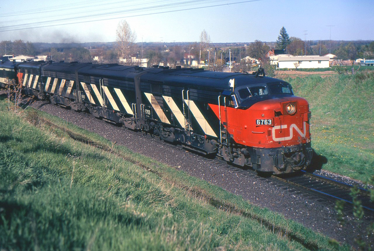 This westbound VIA passenger train, with an A-B-B-A of MLW FPA-4s is on CP's Belleville Sub. due to a derailment which has blocked both main lines of CN's Kingston Sub. just east of Bowmanville. The photo is taken about an hour before the Turbo Train detour picture I posted a few weeks ago.