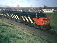 This westbound CN passenger train, with an A-B-B-A of MLW FPA-4s is on CP's Belleville Sub. due to a derailment which has blocked both main lines of CN's Kingston Sub. just east of Bowmanville. The photo is taken about an hour before the Turbo Train detour picture I posted a few weeks ago.