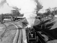 Departing the platforms of Canadian National's Sunnyside Station in Toronto, CNR Hudson 5702 leads her short London-Toronto passenger train the final few miles east to Union Station downtown.
