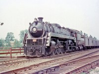 Canadian National 4-8-2 6070 (one of CN's famed U1f class "Bullet Nose Bettys") stops at Port Credit Station with a passenger train in 1956.
