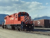 During the 1980's the railway scene in Kelowna was interesting. I always seemed to find a CP or CN unit somewhere in the yards. On this particular day CP 3031 was moving cars around the area near me. I took around 3  photographs CP 3031 before moving on. I like this picture because it shows the human side of day to day railway operations. Parking near there was never an issue, & there was a small hill that you could climb to get a better view of the yards. At the time I had the impression that there was enough local business to keep the railways busy for years, but sadly I was wrong! The days before the idiots with spray cans, & no respect for the railways were great.