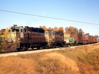 CP 5002 West with GP35 5002 leading RS18 8763 round the curve at Mile 55.3 of CP's Galt Sub (just east of Killean siding), near Clyde Road in October of 1966.