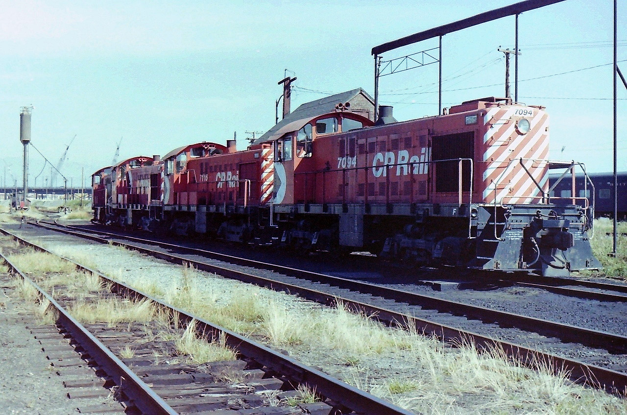 As I remember this photograph was taken on nice Sunday in Sept. 1981. Which Sunday! Can't remember! I spent around 2 hours at the site & never saw any CP employees. This allowed me to walk around with a little freedom, but as per my policy I kept off the equipment, & only took photographs. The idea of the trip was to photograph the site before the ongoing Expo 86 construction erased any more evidence of the CPR Drake St yards being there. The locomotives in the picture are photographed from the dark side because the good side was blocked by steam era oil house. Sadly there was so much more to see, & not enough film to capture it.