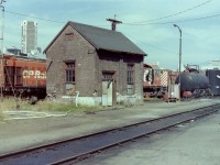 The oil house building shown in the picture is a very small, but important piece of Vancouver railway history. CP locomotives 7113/7117/7116/7094 were sitting behind the building, but the area in front of it was clear which allowed for a good photograph. To the right of the building is the lube oil tank, & the waste oil tank. All in all there is a lot of history in the picture. The brick oil house was made to last, & by it's looks it took a pounding over the years. I took many pictures of railway buildings over the years because I felt that they were also an important piece of history. Today buildings like this are long gone! I have to thank my friend Andy Cassidy for telling me what the building, & the tanks were used for. 