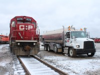 GP38-2 was running on fumes, so it was decided to bring it to track 1 east which is right by a roadway and saved time by allowing the mobile fuel tanker to fill it up.