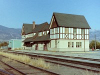 After finishing my work at the Penticton post office I wandered over to the CP (KVR) yards to take some photographs. A quick look,& you could see that remaining railway buildings were in the last stages of their lives. At one time the area was a beehive of activity, and an important industry for the town. Today, only the old timers could indicate the actual location of the old CP yards. What was, is now totally erased. As for the station, I took two pictures of it. One from the track side, & one from the street side. The green building on the left side of the station was a more recent addition to it. 