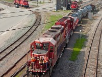 How things change. Only a few years ago, yard power at Toronto Yard was a mix of chop-nose GP9s and slugs. Now, it is all GP38-2s and GP20-ECOs. Even more dramatic has been the decrease in the size of the yard, with the centre now completely devoid of tracks. In this leaner setup, CP 3021 and 2281 head out of the yard to work local customers on a lazy Victoria Day long weekend.