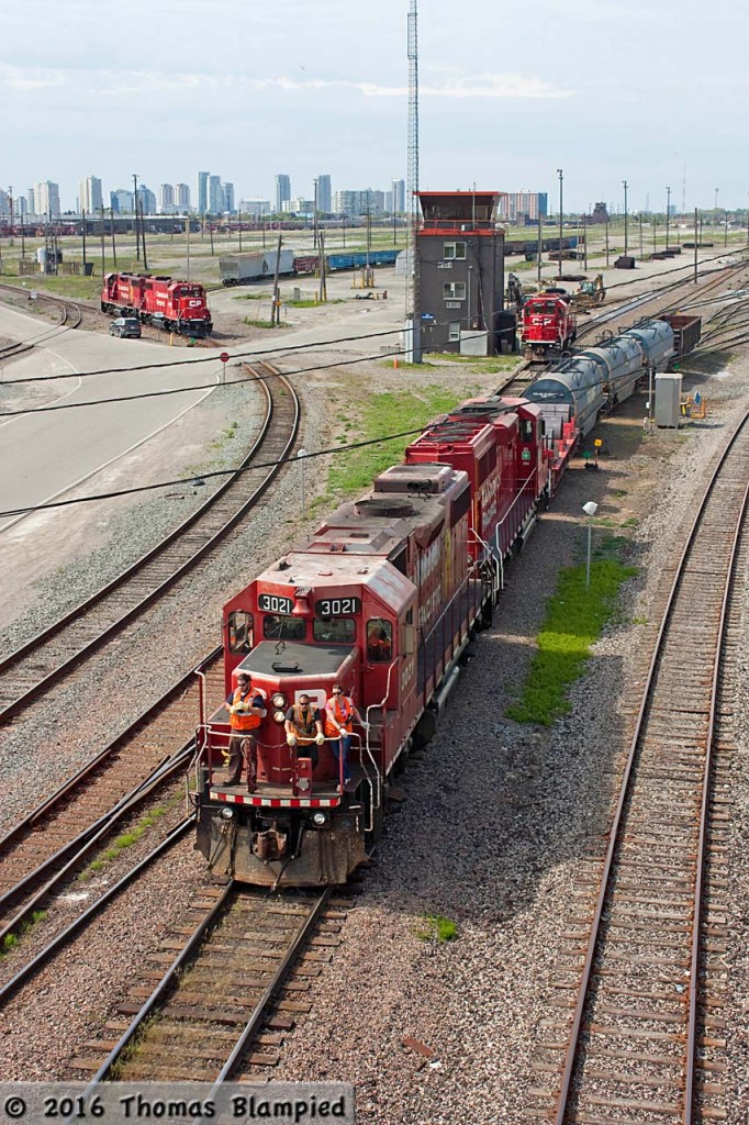 How things change. Only a few years ago, yard power at Toronto Yard was a mix of chop-nose GP9s and slugs. Now, it is all GP38-2s and GP20-ECOs. Even more dramatic has been the decrease in the size of the yard, with the centre now completely devoid of tracks. In this leaner setup, CP 3021 and 2281 head out of the yard to work local customers on a lazy Victoria Day long weekend.