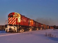 Late evening on Feb 27, 1988 and CPR train 911 is nearing Sault Ste. Marie in the last light of day with C424's 4226, 4231, 4247 and AC 183 leading 34 cars.