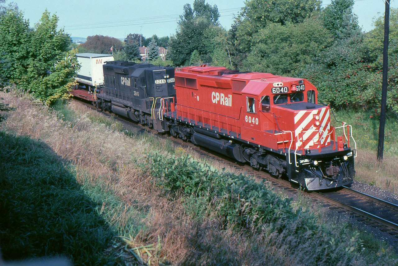 CP 6040 West is stopped near mile 164 of the Belleville Sub., having struck a man on the track about 1/2 mile east of this point. They were here for 1 hour and 20 minutes and although I do not recall, the crew was likely changed. The second unit is one of 11 former Norfolk Southern SD-40-2s bought from GATX in 1992. They were GATX 3244-3254 and were renumbered CP 5475-5483 in 1993.