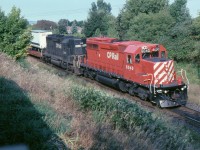 CP 6040 West is stopped near mile 164 of the Belleville Sub., having struck a man on the track about 1/2 mile east of this point. They were here for 1 hour and 20 minutes and although I do not recall, the crew was likely changed. The second unit is one of 11 former Norfolk Southern SD-40-2s bought from GATX in 1992. They were GATX 3244-3254 and were renumbered CP 5475-5483 in 1993.