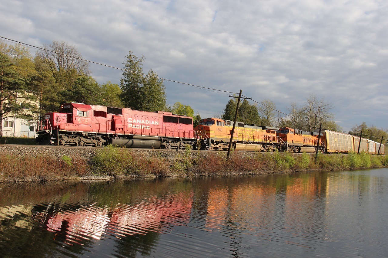 After stopping in the lovely village of Campbellville, Ontario for a rest, CP 244 drifts through town with a lengthy 5-car train and CP 6229-BNSF 4566-BNSF 8362 providing the power. Time - 18:34. (First checked the signals and saw a green for an eastbound then got the FPON message; missed the westbound.)