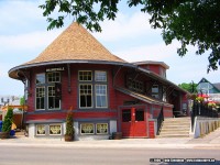 There are only four stations in Ontario today that have the so-called 'Witch's Hat' roofline...ex-CN Wainfleet, ex-CN Blyth, ex-CP Parry Sound and the ex-CP Orangeville station.
<br> 
Now relocated to Armstrong Street and used as the Barley Vine Rail Restaurant, this station has seen it all. Also once used in a divisional point, it became a restaurant and I have the pleasure to say I ate there on my first visit in 2003. It was an Italian eatery then, and the food was exceptional.
<br>
Disaster struck a short time after as fire ripped through the station and destroyed the roof. Rebuilt, it housed a Sushi place upon this visit in 2006. 
<br>
Thankfully, that was short lived and it became a fancier eatery sometime later, and was even on the popular Food Network TV show "You Gotta Eat Here". Glad to see it is a popular stopping place again.   