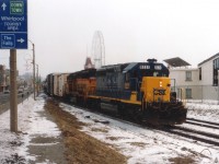It might have been a dull and damp March day, but I warmed up quickly when I saw this version of #321 rolling thru Clifton Hill. Not often did I see a clean yellow nose CSX 6221, my favourite of their paint schemes, followed by 'the cat' 6218. CSX had only 5 more years of running their trains thru Niagara, and the rail line itself would be gone by 12/2001 to make way for a Casino.