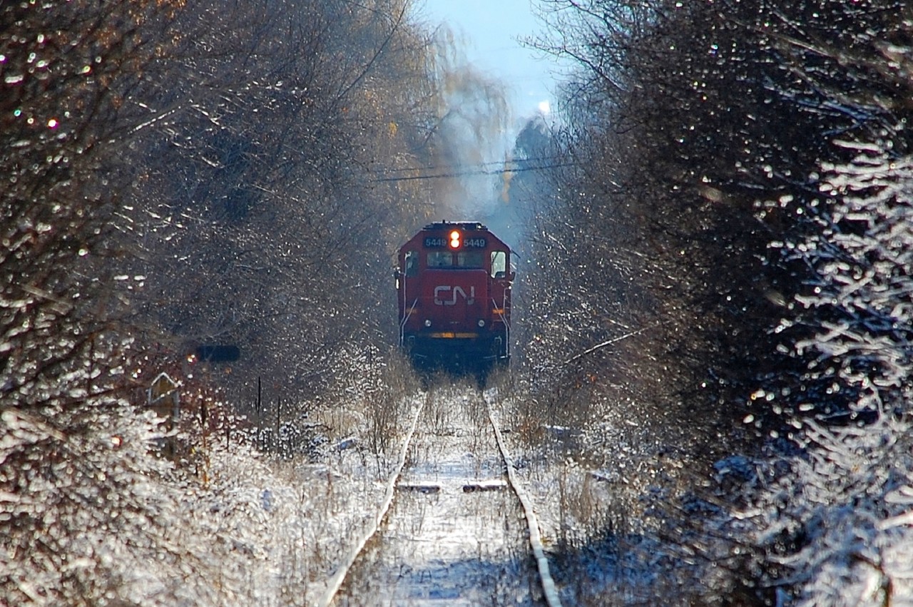 The CN line between Vernon and Kelowna has been removed. CN 5449 is in charge of the work train lifting the track and is seen at work near Kelowna Airport.