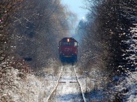 The CN line between Vernon and Kelowna has been removed. CN 5449 is in charge of the work train lifting the track and is seen at work near Kelowna Airport.