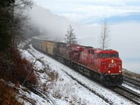 CP 8713 leads an eastbound load of empty potash cars alongside Shuswap Lake near Mowitch.