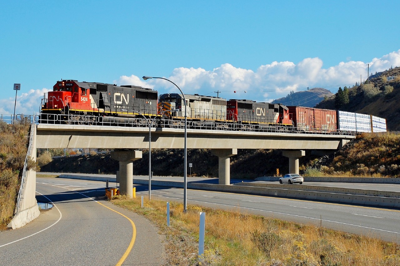 CN nos.5424,5406 &GTW 5945 bring a northbound mixed freight across Hwy1 at Campbell Creek which is just east of Kamloops.