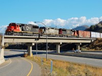 CN nos.5424,5406 &GTW 5945 bring a northbound mixed freight across Hwy1 at Campbell Creek which is just east of Kamloops.