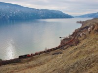 CN 5428 is in charge of the work train that is lifting track between Vernon and Kelowna. This shot is taken near Kekuli bay on Kalamalka Lake.