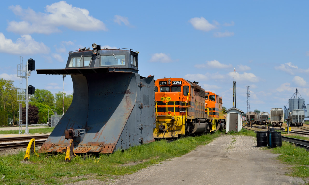 Returning from a family trip to St. Mary's, we stopped in Stratford for a quick look at the yard.  Here, GEXR's 1938 built wedge plow rests in the spring sun after only one run this year.:(  Behind is GEXR SD40-2 3394 coupled with GP40-2LW 3030, which came off 431 the previous day.  Taggers recently hit the plow blades on the front of 3394 and 3030.